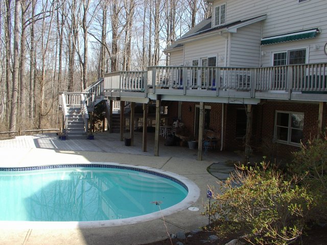 3,000 Sq. foot composite pool deck with stairs and under decks.